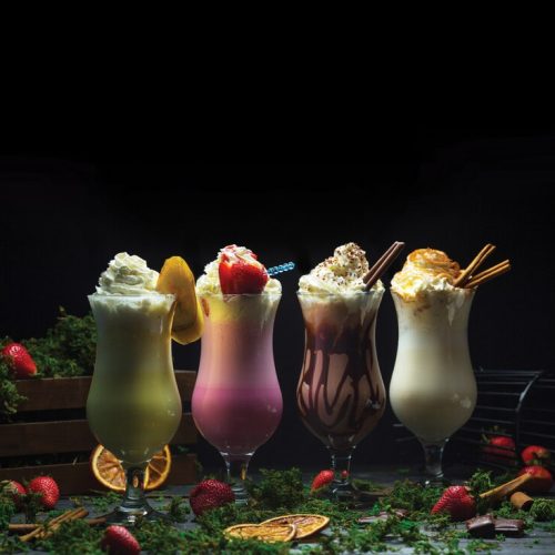 four-different-cocktail-smoothies-with-milky-cream-top_114579-1097